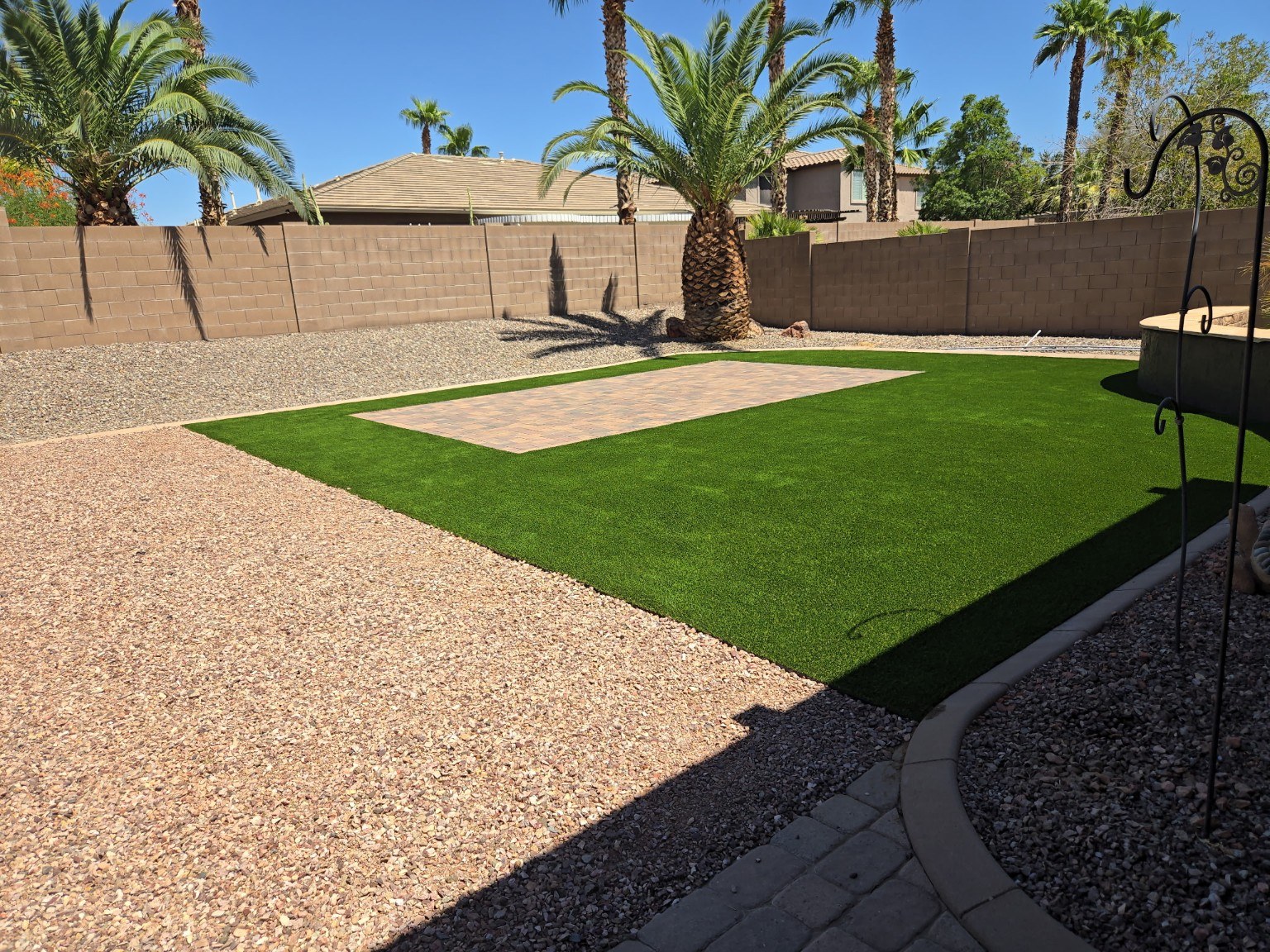 Large artificial turf yard with paver patio